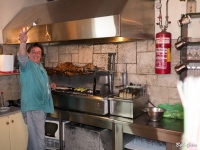 Kostas slaving over the lamb.